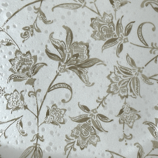 Close up of a square salad plate with a textured floral design