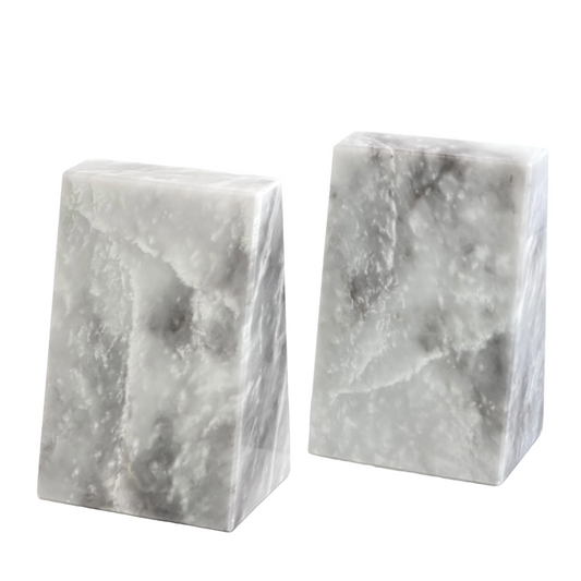 Two marble bookends on a white background
