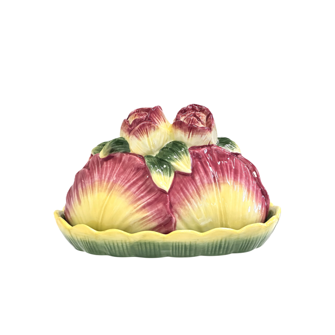 Ceramic fruit-shaped butter dish with pink and yellow roses and cabbage leaves on a lilypad base