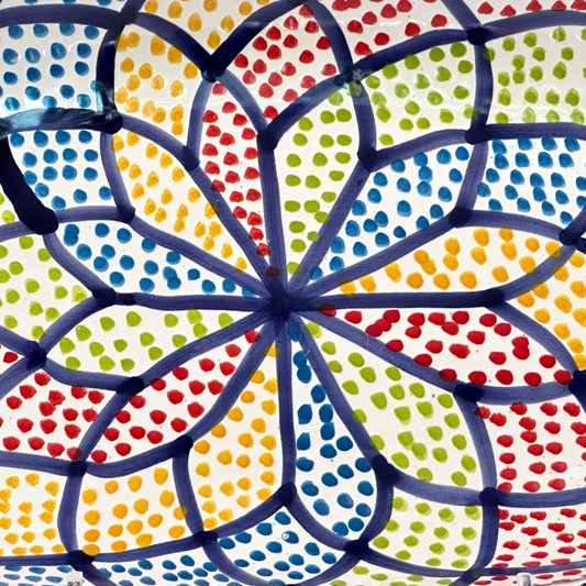 Colorful dot pattern with concentric circles on a white background