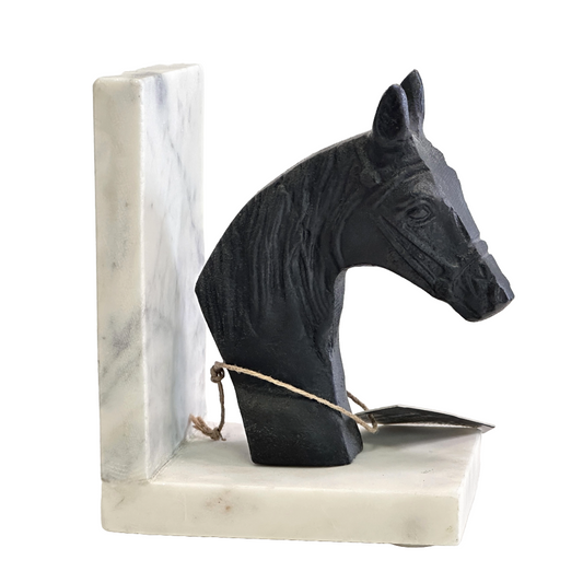 Black horse head sculpture on a marble base