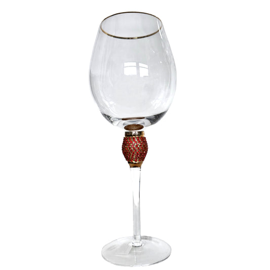 Wine glass with decorative base on a white background