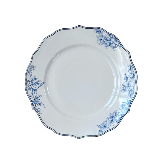 White plate with blue floral patterns on a white background