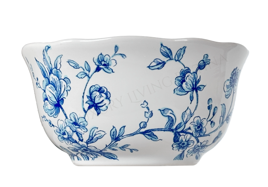 White ceramic bowl with blue floral patterns on a white background