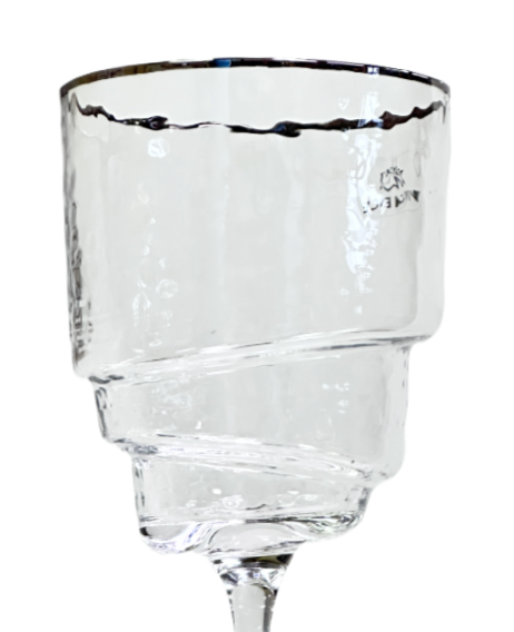 Clear wine glass with a thin base on a white background