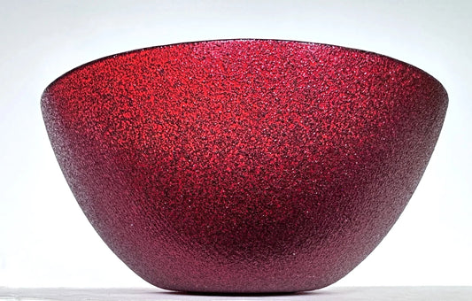 Red glass bowl with speckled texture 