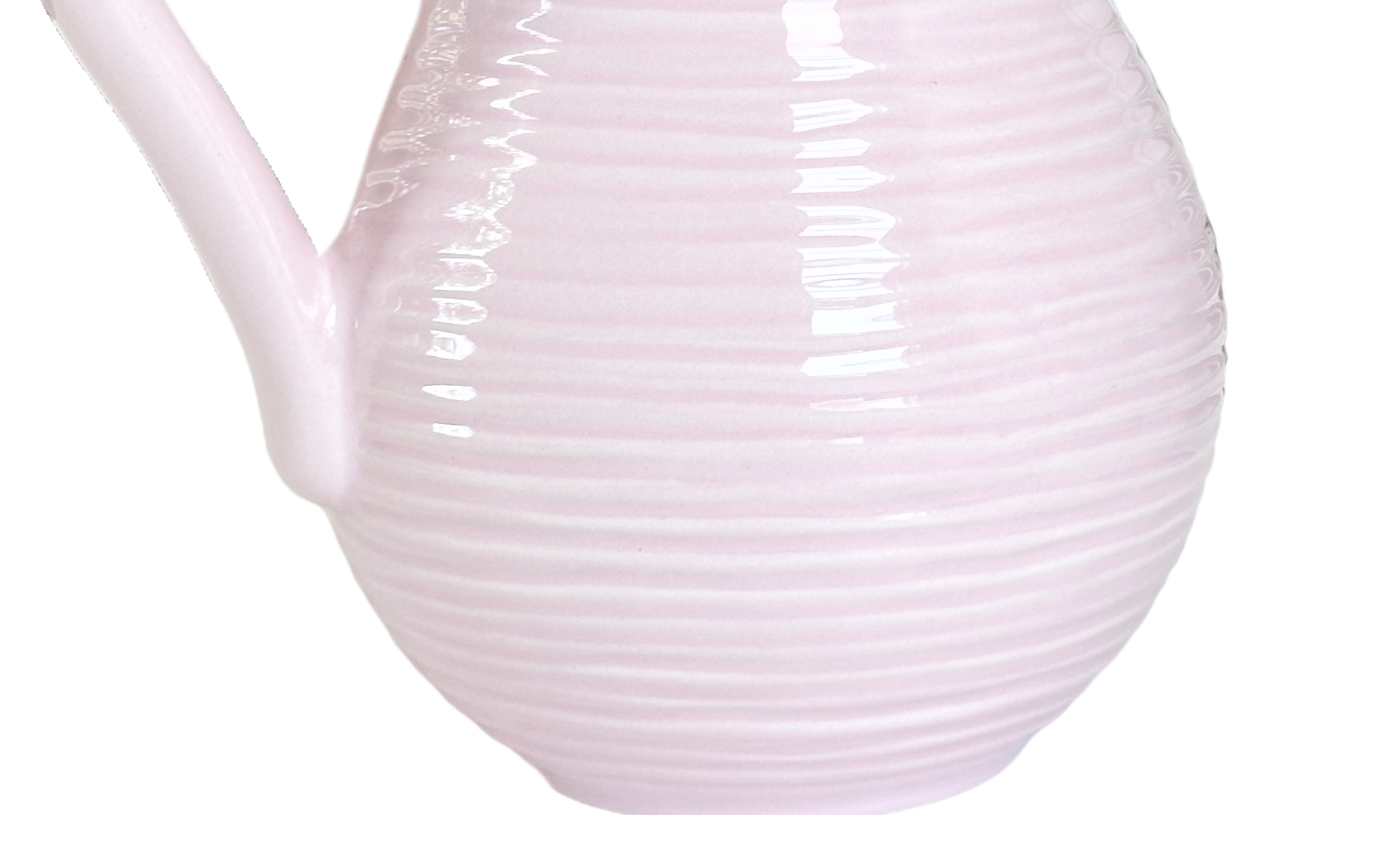 White ceramic pitcher with ribbed texture