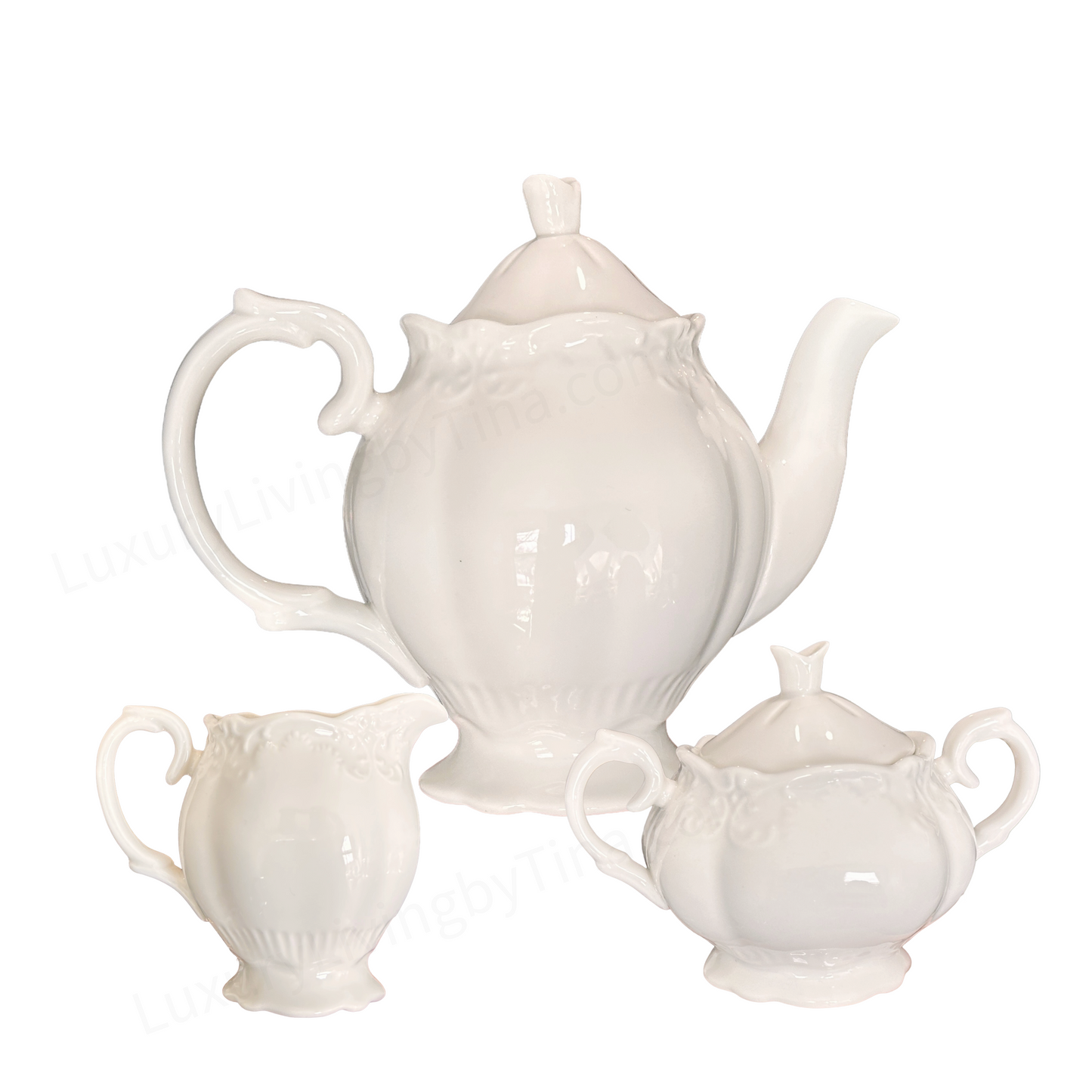 White Porcelain Tea Service with Curved Spout, Ornate Handle, And Domed Lid