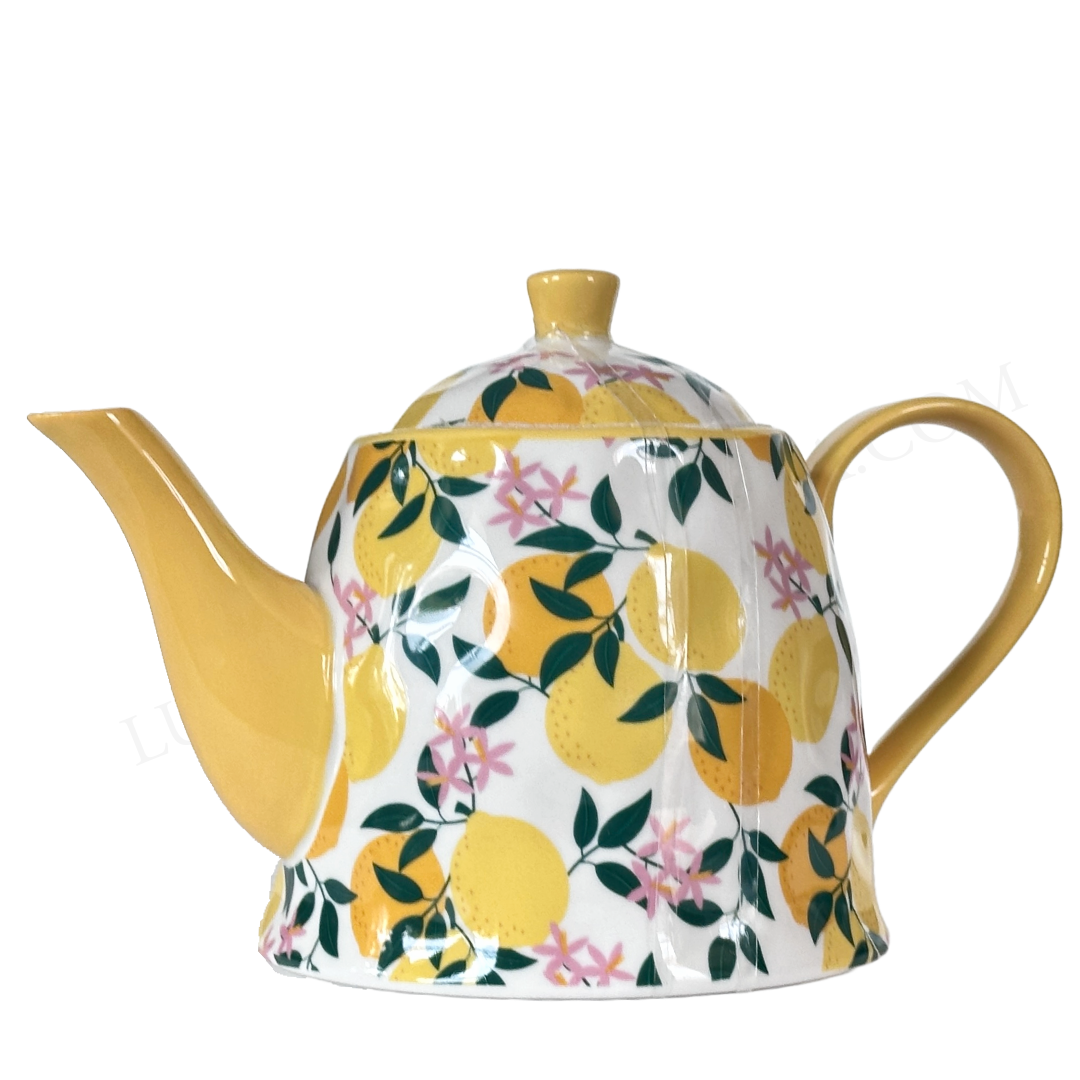 Teapot with lemon and floral pattern on a white background