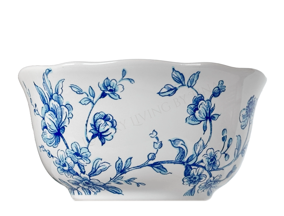 White ceramic bowl with blue floral patterns on a white background