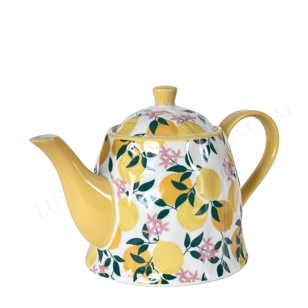 Teapot with lemon and floral pattern on a white background