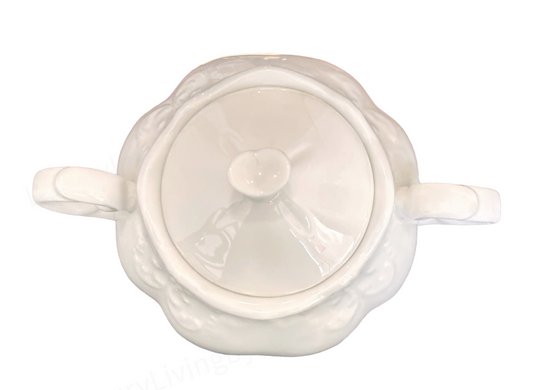 White Porcelain Tea Service with Curved Spout, Ornate Handle, And Domed Lid