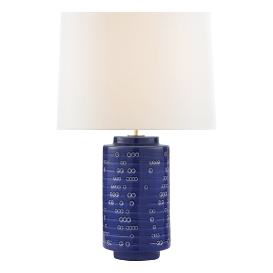 Table lamp with a blue ceramic base and white shade on a white background