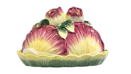 Ceramic fruit-shaped butter dish with pink and yellow roses and cabbage leaves on a lilypad base