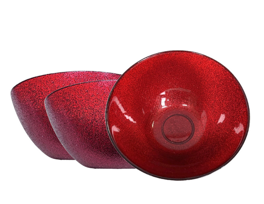 three red glass bowls with speckled texture 
